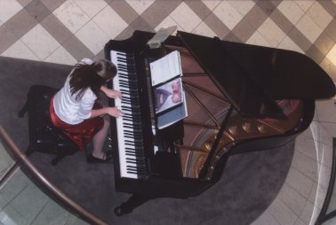 Student playing piano at Nordstrom