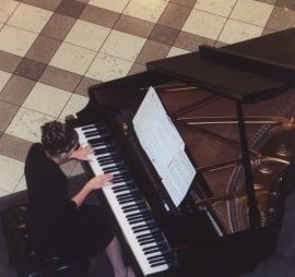 Student playing piano at Washington Square Nordstrom